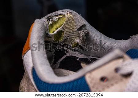 Closeup old broken shoes. The heel part of shoe in image has worn out and damaged. Photo stock © 