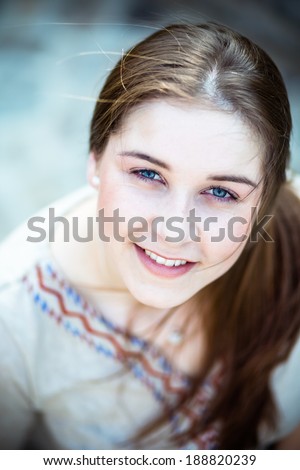 Girl with blue eyes smiling
