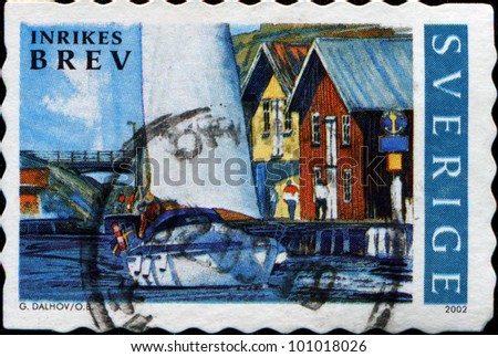SWEDEN - CIRCA 2002: A stamp printed in Sweden shows snow Yacht and waterfront houses , circa 2002