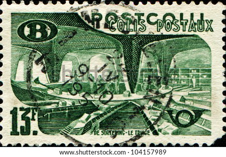 BELGIUM - CIRCA 1950: A railway stamp printed in Belgium shows sorting letters at the post office, Brussels, circa 1950
