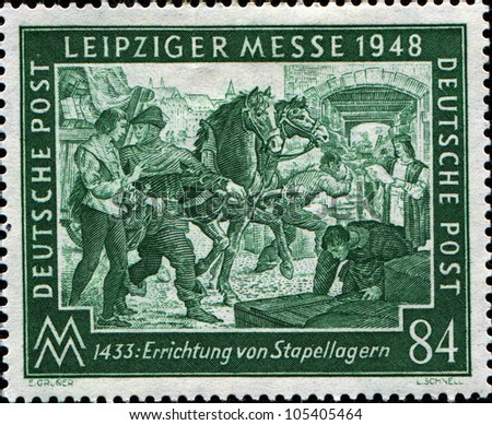 GERMANY - CIRCA 1948: A stamp printed in Germany, American, British and Russian Zones,  honoring Leipzig Spring Fair 1433, shows Bringing merchandise, circa 1948