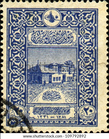 TURKEY - CIRCA 1915: A stamp printed in Turkey shows old building of the post office in Constantinople, about 1865 (Postahane-I Amire)  Post Office Department in courtyard of a new mosque (Yeni Cami)