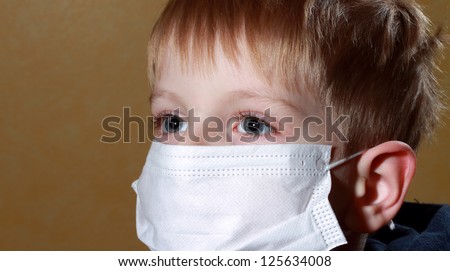 little boy in medicine healthcare mask