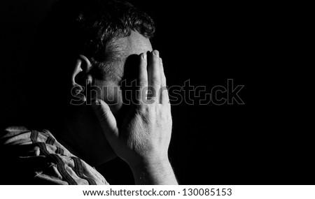 Worried middle-aged man, black and white