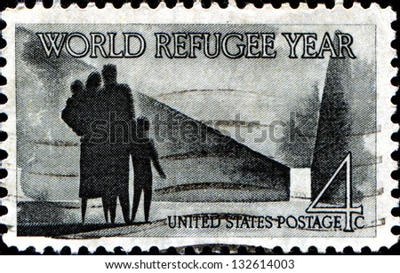 USA - CIRCA 1960: A stamp printed in United States of America shows Refugee Family walking toward New Life, World Refugee Year Issue, circa 1960