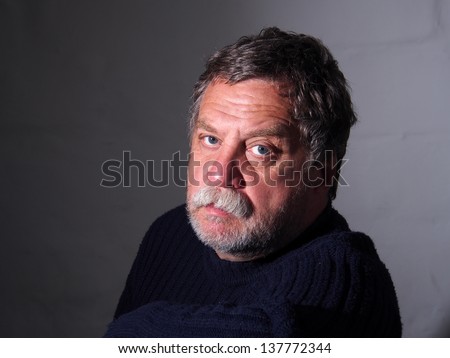 sad middle-aged bearded man