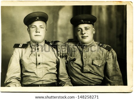 USSR - CIRCA 1960s: Vintage photo shows studio portrait of two junior sergeant of the Soviet Army, 1960s