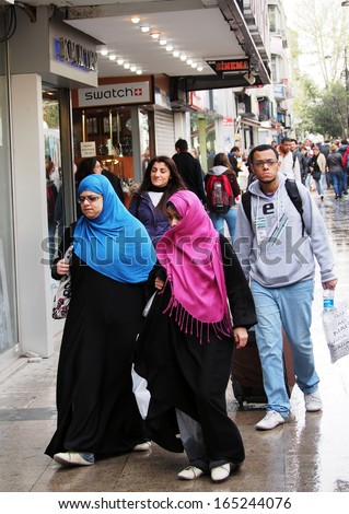 ISTANBUL - Apr 21: Two women wearing hijabs go to the street on Divan yolu  on April 21, 2013, Istanbul, Turkey