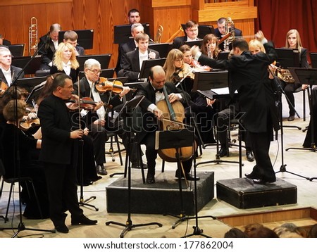 UKRAINE, LUGANSK - February 20, 2014: Lugansk Symphony Orchestra gave a requem concert. The conductor of the orchestra was Sergey Chernyak, Soloists  - Taras Mentsynsky and Yuri Kirichenko