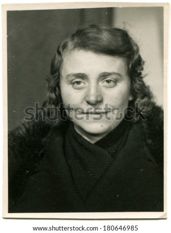 GERMANY - CIRCA 1946: An antique studio portrait of a middle-aged woman in winter coat