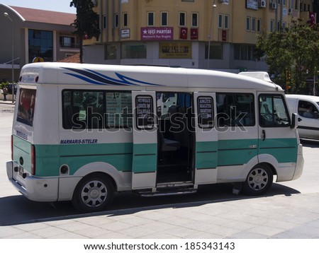 TURKEY, MARMARIS - April 26, 2013: Karsan on bus stop. This small buses are most common way to travel on short distances, Karsan is a Turkish commercial vehicles manufacturer
