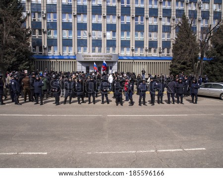UKRAINE, LUGANSK - April 5, 2014; Pro-Russian activists protests near Regional Office of Security Service of Ukraine. They demanded to give freedom to detainees leaders pro-Russian movement of region