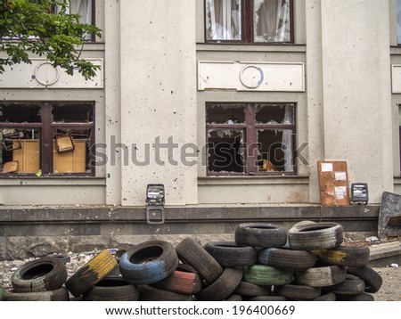 LUHANSK, UKRAINE - June 2, 2014: Administrative building windows were smashed by bullets. Separatists were trying to take down Ukrainian Air Force MiG-29 with missile shot