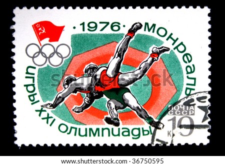 USSR - CIRCA 1976: A stamp printed in the USSR shows wrestling, devoted to Summer Olympic Games in Montreal, one stamp from series, circa 1976.