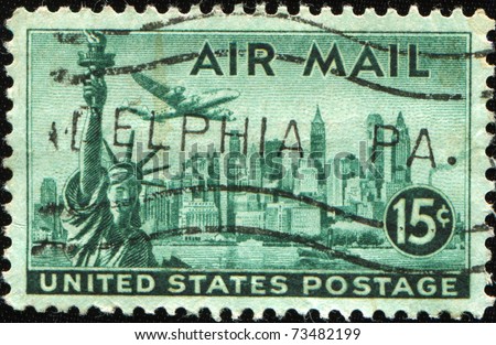 UNITED STATES OF AMERICA - CIRCA 1947: A stamp printed in the United States of America shows Statue of Liberty in the background of New York, circa 1947