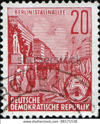 EAST GERMANY - 1953: A  stamp printed in East Germany shows Stalin-Allee (also known as the Karl-Marx-Allee) in Berlin, series, circa 1953