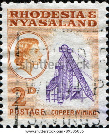 RHODESIA & NYASALAND - CIRCA 1959: A stamp printed in Rhodesia and Nyasaland shows copper mining, circa 1959