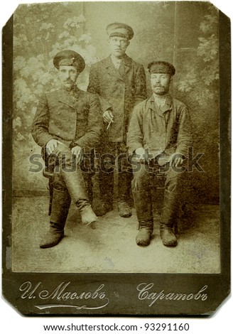 RUSSIA - CIRCA end of the XIX - the beginning of XX century: Three railway workers, Saratov, Russian Empire Russian text: Maslov (name of photographer), Saratov