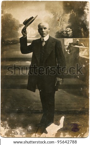 RUSSIAN EMPIRE - CIRCA 1911: young man with an easy arm is raised to salute the hat, the Russian Empire, 1911