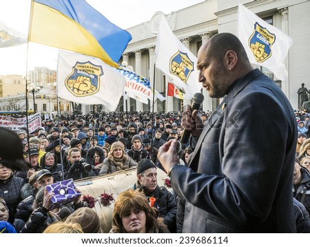 KIEV, UKRAINE - December 23, 2014: Deputy Borislav Bereza tries to calm protesters -- To break through the cordon of police and four special forces in full uniform