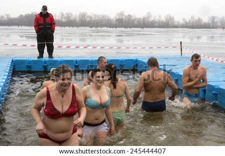 KIEV, UKRAINE - January 18, 2015: Ukrainian Church of the Moscow Patriarchate traditionally celebrated Epiphany in Obolon. Believers are dipped in the water of the Dnieper.