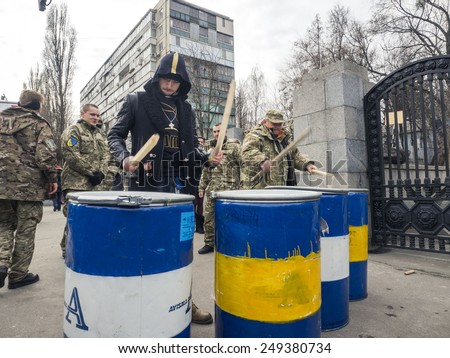 KIEV, UKRAINE - February 2, 2015: Battalion Aydar drumming on metal barrels at gates of Ministry of Defense of Ukraine in Kiev. Volunteers of Aidar battalion picket in front of the Ministry of Defense