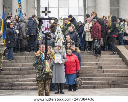 KIEV, UKRAINE - February 2, 2015: A public farewell is given for a Ukrainian soldier who was killed in Eastern Ukraine. A funeral for an Azov Battalion soldier was held in Independence Square in Kiev.