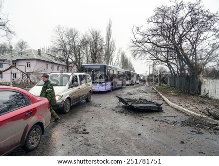 DONETSK BASIN, UKRAINE - FEBRUARY 6, 2015: A bus column for refugees, escorted by pro-Russian rebels, which moves between Debaltseve and Uglegorsk cities