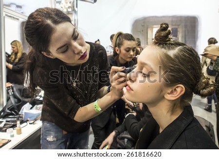 KIEV, UKRAINE -MARCH 18, 2015: A model has her makeup done backstage during Ukrainian Fashion Week