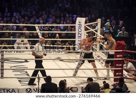 KIEV, UKRAINE - April 18, 2015: Fight between Ukrainian boxer Alexander Usyk from Klichko brothers company K2 technical knockout in the eighth round of the Russian boxer defeated Andrei Knyazev
