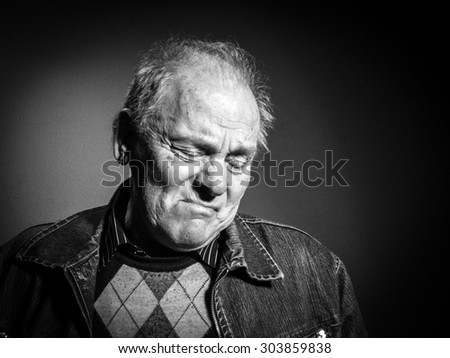 Portrait of sad elderly man