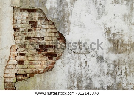 The old cracked wall of the abandoned ruins.