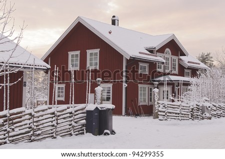 Swedish rural red house in a winter mornings setting