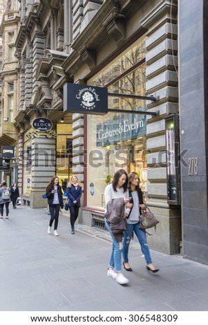 Melbourne, Australia - August 8, 2015: People walking along Collins Street in Melbourne\'s CBD. The street is the premier street offering five star shopping, clubs, banks and major outlets.
