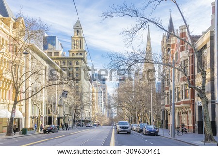 Melbourne, Australia - August 16, 2015: Victorian era buildings in Collins Street in Melbourne\'s CBD with modern buildings in the distance near sunset.