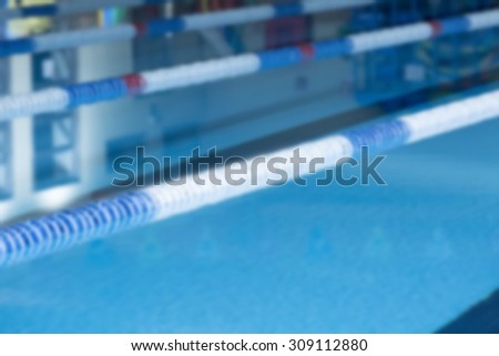 unfocused closeup of lane marker buoys in a indoor swimming pool useful as a background