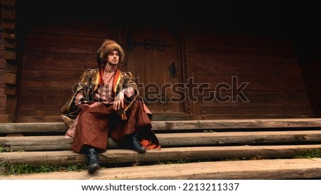 Similar – Image, Stock Photo Ukrainian man warrior dressed in a military pixel uniform stands on a white isolated background