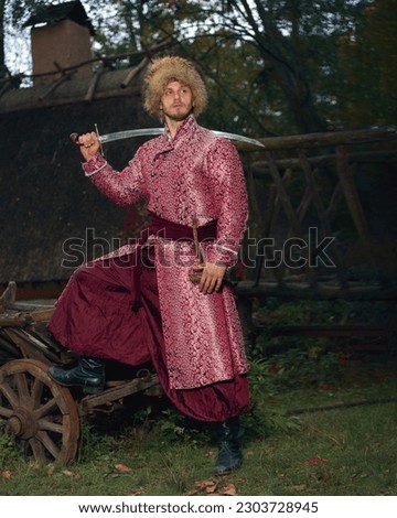 Similar – Image, Stock Photo Ukrainian man warrior dressed in a military pixel uniform stands on a white isolated background