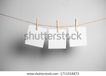 polaroid frame.Retro photo frames hanging on rope isolated on white background. real photo. three frames