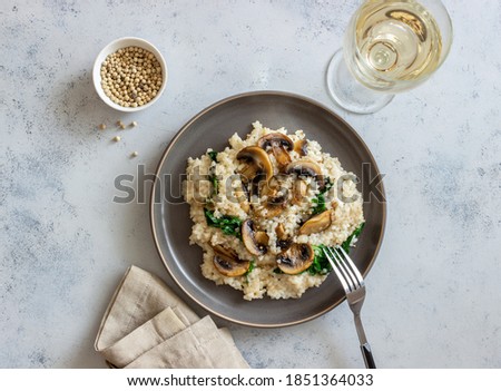 Similar – Rosemary on risotto with rabbit and mushrooms