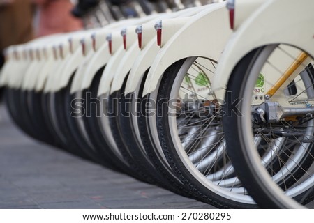 MILAN , ITALY - 10 April 2015 :city bike detail parking in Piazza Cadorna, in Milan. The bicycle is becoming the most frequently used means in the center to limit urban smog