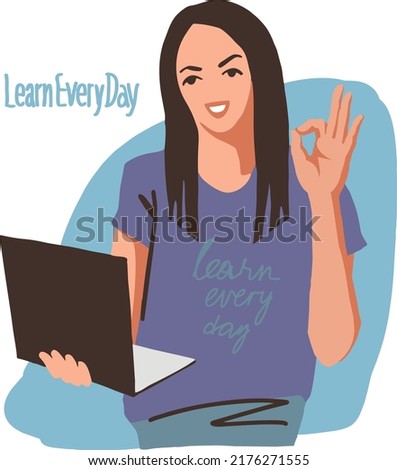 The young woman looks approvingly into the computer. She gestures ok.