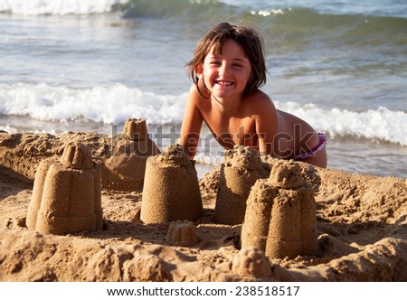 girl play on the beach with a sand