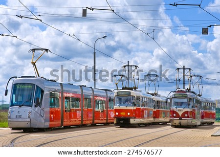 PRAGUE, CZECH REPUBLIC - CIRCA JUNE 2014: various types of tramways on Barrandov station. Modern Skoda T14 tram was designed by Porsche.