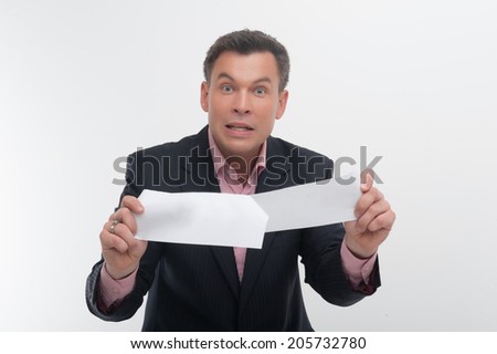 Middle aged angry office worker businessman in elegant suit tears paper isolated on white, concept for breaking contract