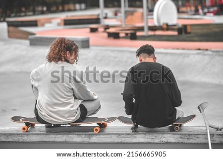 Image, Stock Photo Skateboarder resting on the ramp