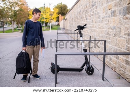 Similar – Image, Stock Photo Parking space for e-scooters and bicycles