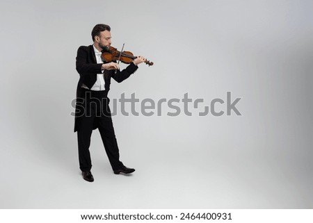 Similar – Image, Stock Photo Man playing violin with face mask