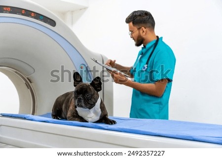 Similar – Foto Bild Tierarzt bei der Vorbereitung eines Hundes für eine Tomographieuntersuchung in der Klinik