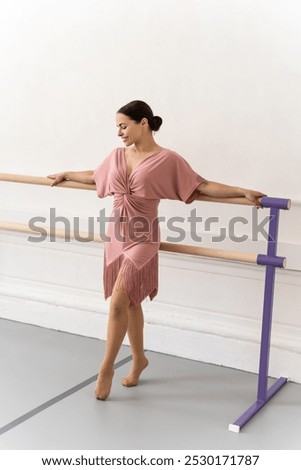 Similar – Image, Stock Photo Ballerina standing on tiptoe classical position outside